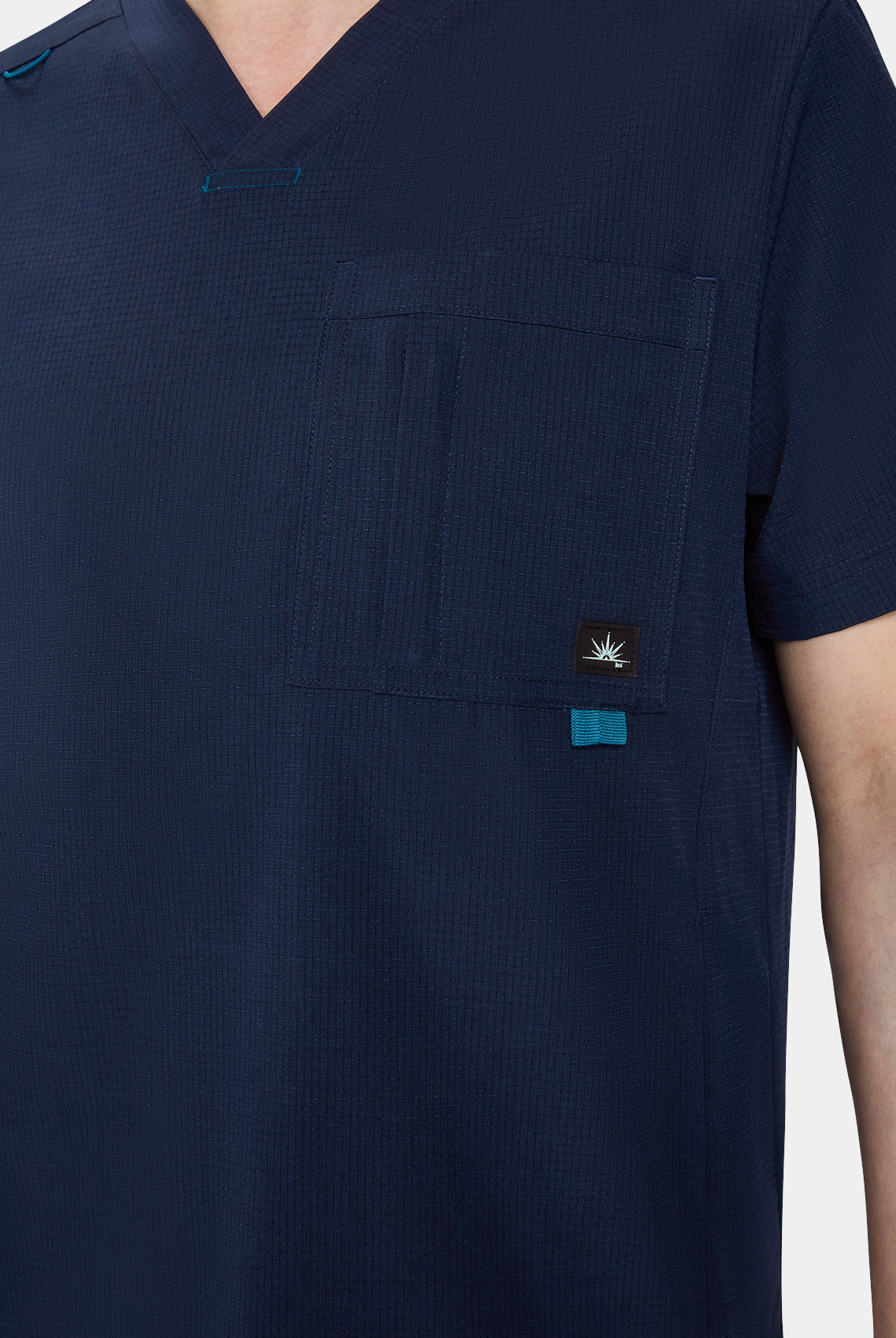 Men's Koi Solis Caldwell scrub top navy closeup