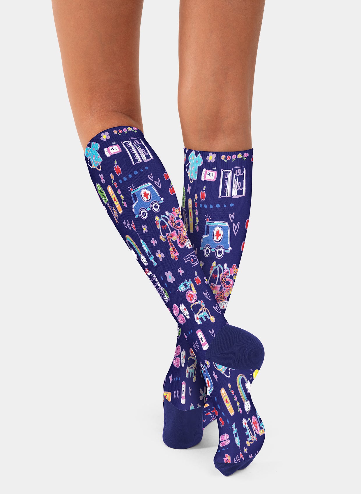 Navy blue knee-high compression socks with colourful ambulance pattern