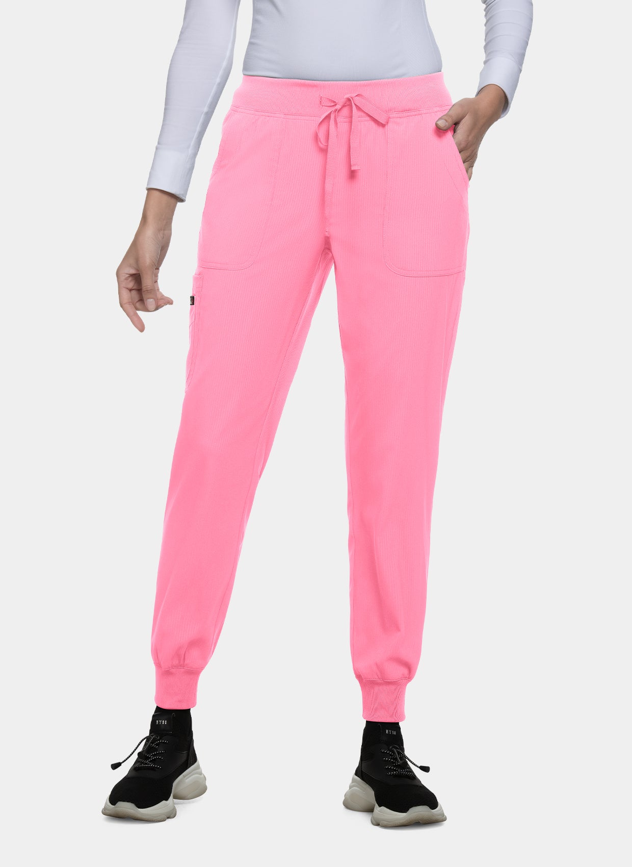 Women's bright pink jogger scrub trousers with drawstring waist, ribbed cuffs, and side pockets, worn by a model.