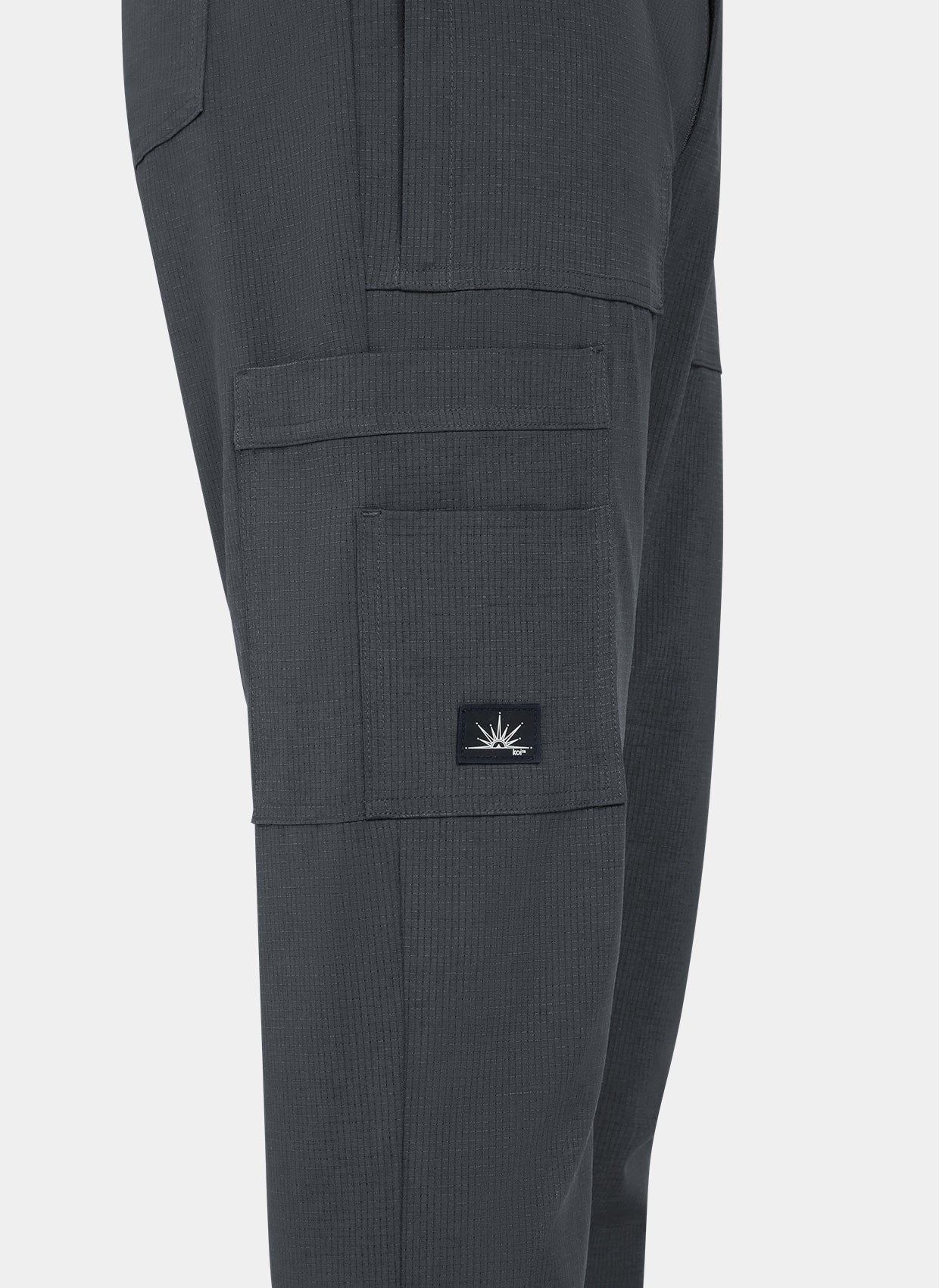 Men's Koi Solis scrub trousers charcoal closeup