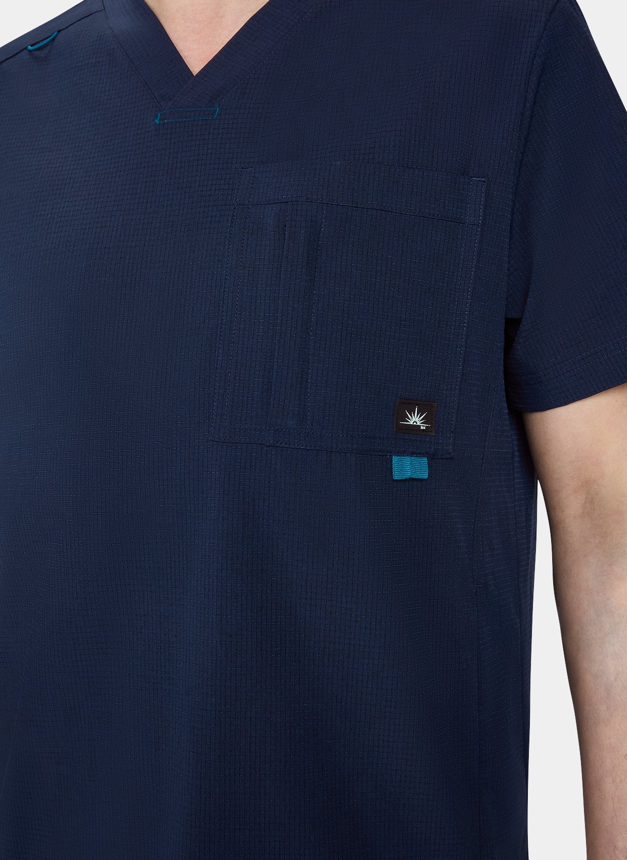 Men's Koi Solis Caldwell scrub top navy closeup