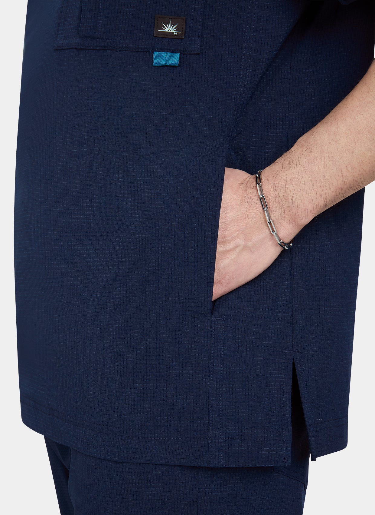 Men's Koi Solis Caldwell scrub top navy closeup