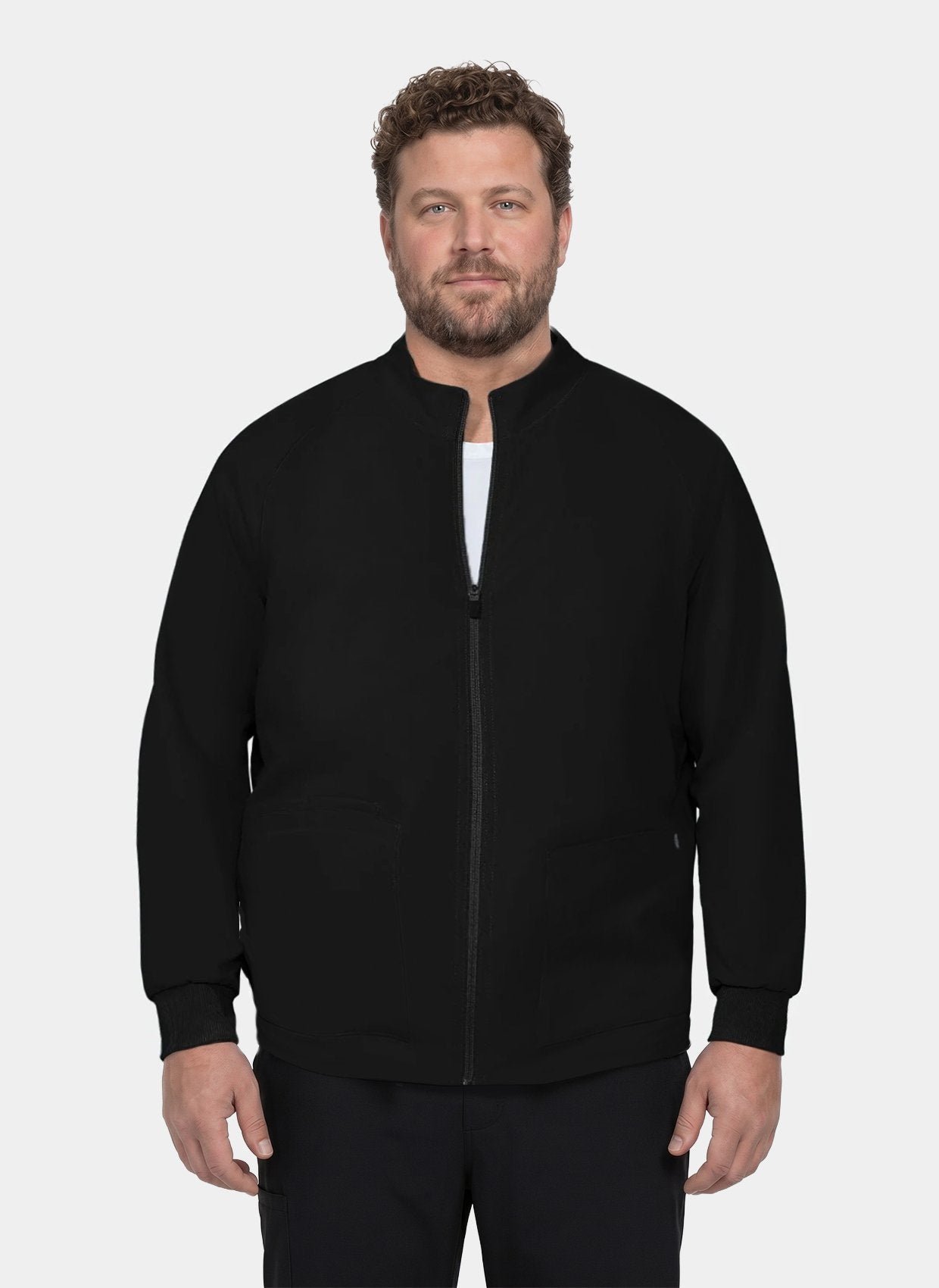 Men's black scrub jacket with stand collar, front zip fastening, long sleeves and front patch pockets, shown on a model.
