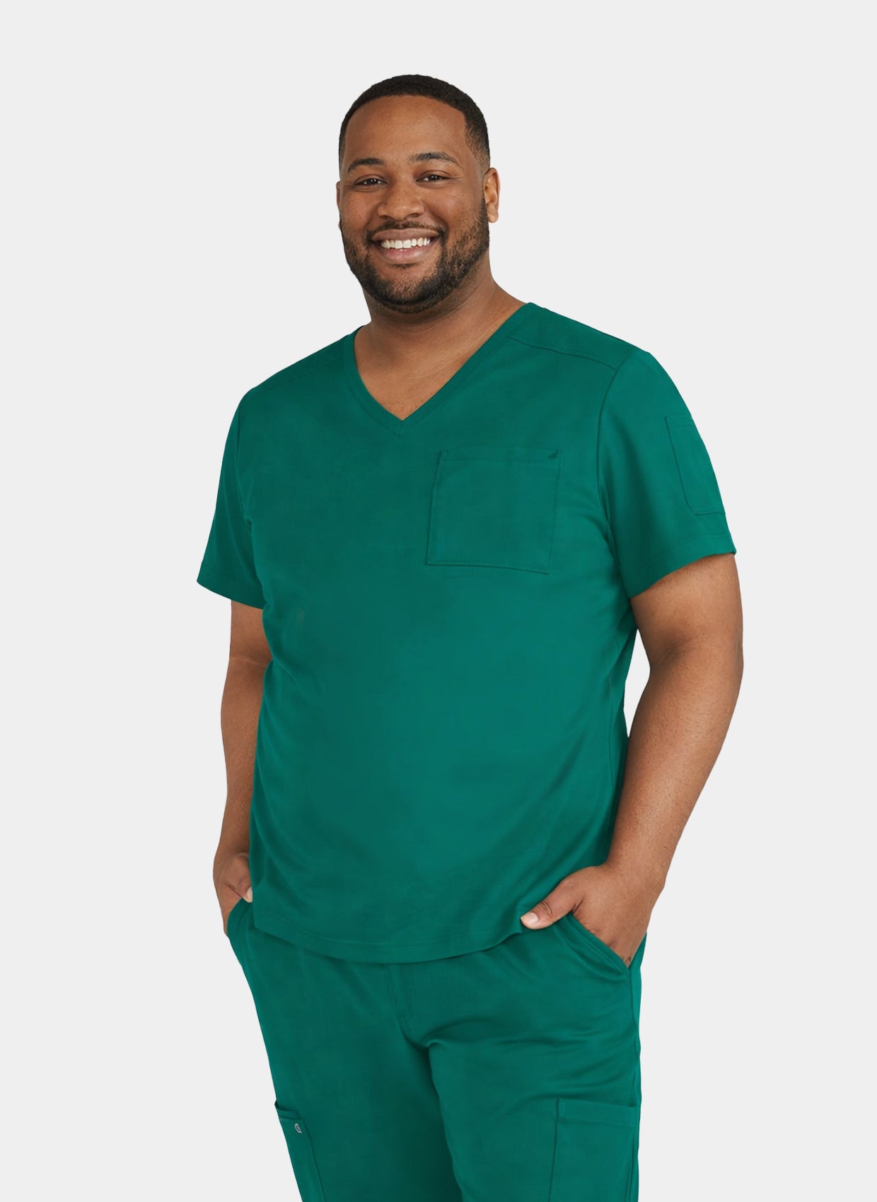 Men's hunter green V-neck medical scrub top, front view, worn by a model with short sleeves and chest pocket.

