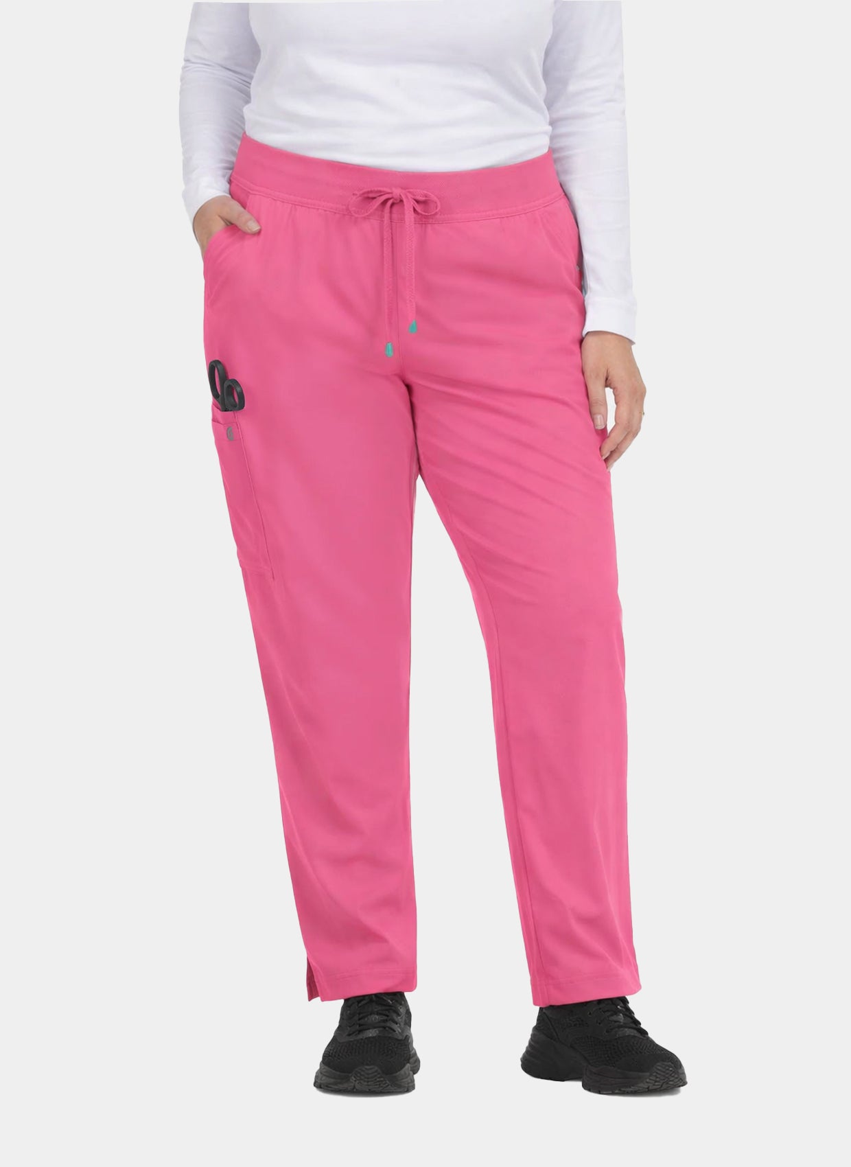 Plus-size model wearing bright pink straight-leg scrub trousers with drawstring waistband, side pockets and utility pocket
