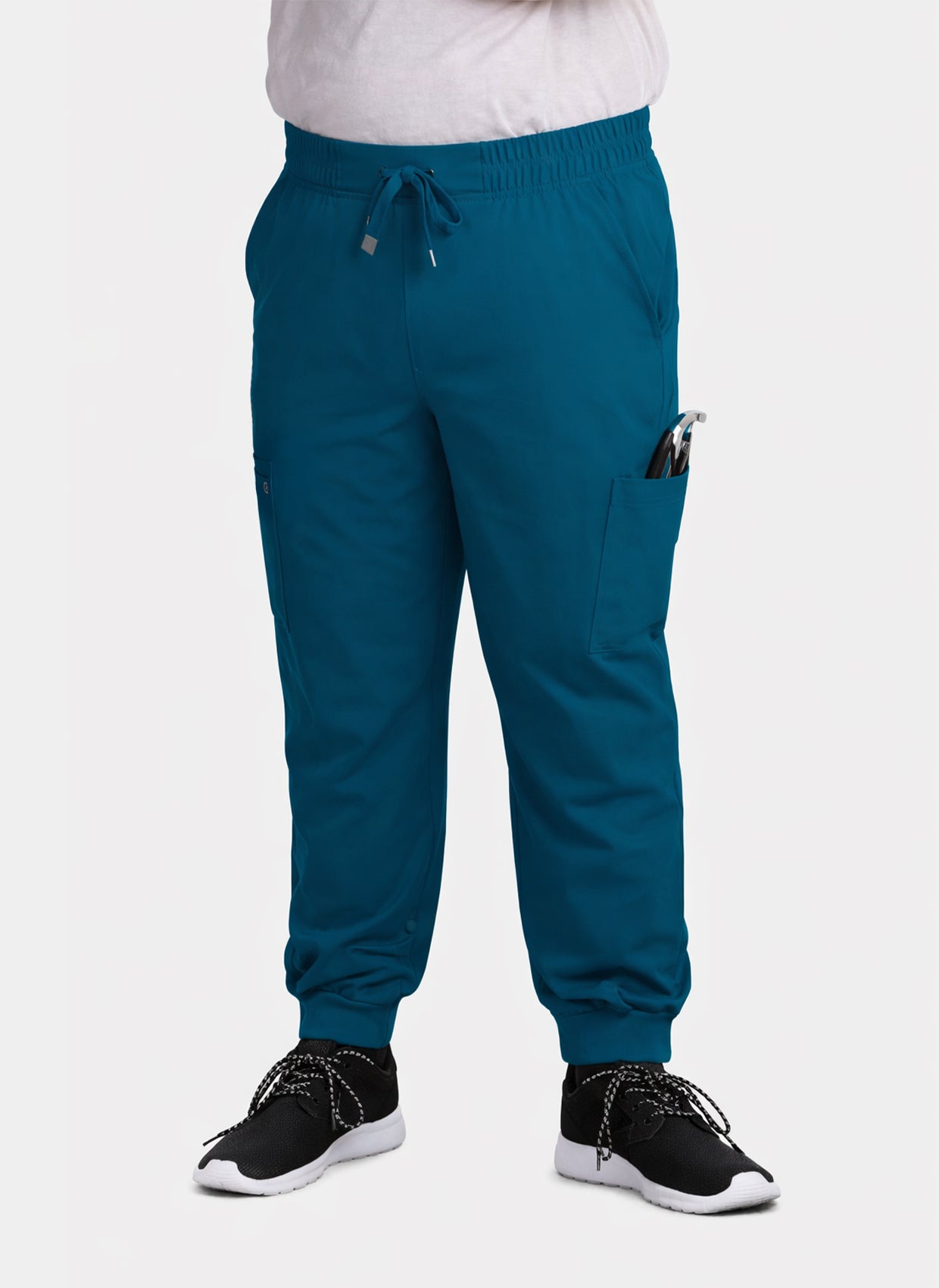 Women's Caribbean blue jogger scrub trousers with cargo pockets, drawstring waist, ribbed ankle cuffs and a phone pocket.
