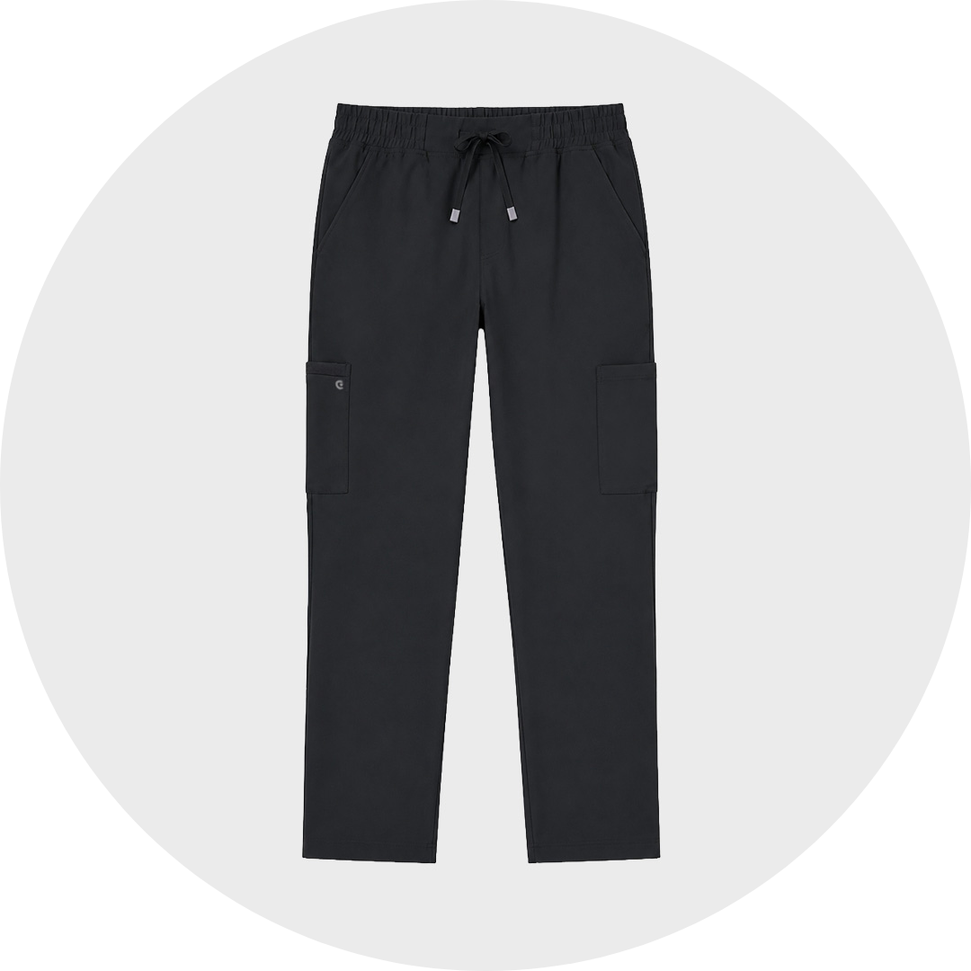 Black short jogger-style cargo mediacal scrub trousers with an elastic drawstring waist, curved seams, and two large side cargo pockets, shown flat against a light gray circular background.