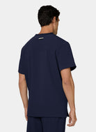 Koi Next Gen Flex Forward men's navy scrub top with short sleeves and a button collar