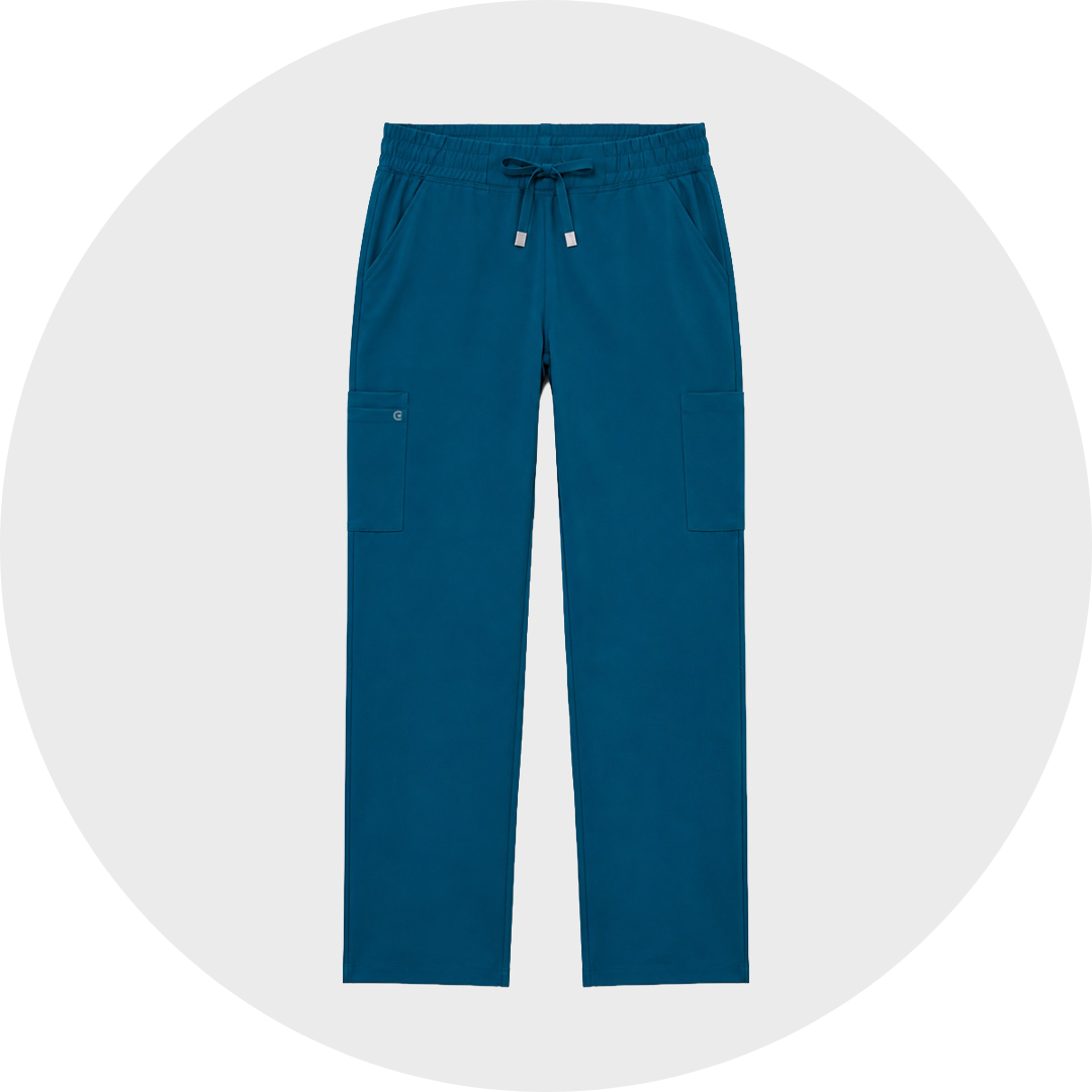 Teal blue jogger-style men's cargo scrub trousers with an elastic drawstring waist and side cargo pockets, shown flat against a light gray circular background.