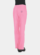 Women's pink straight-leg scrub trousers with back patch pockets and utility pockets, shown from the rear, worn by a model.
