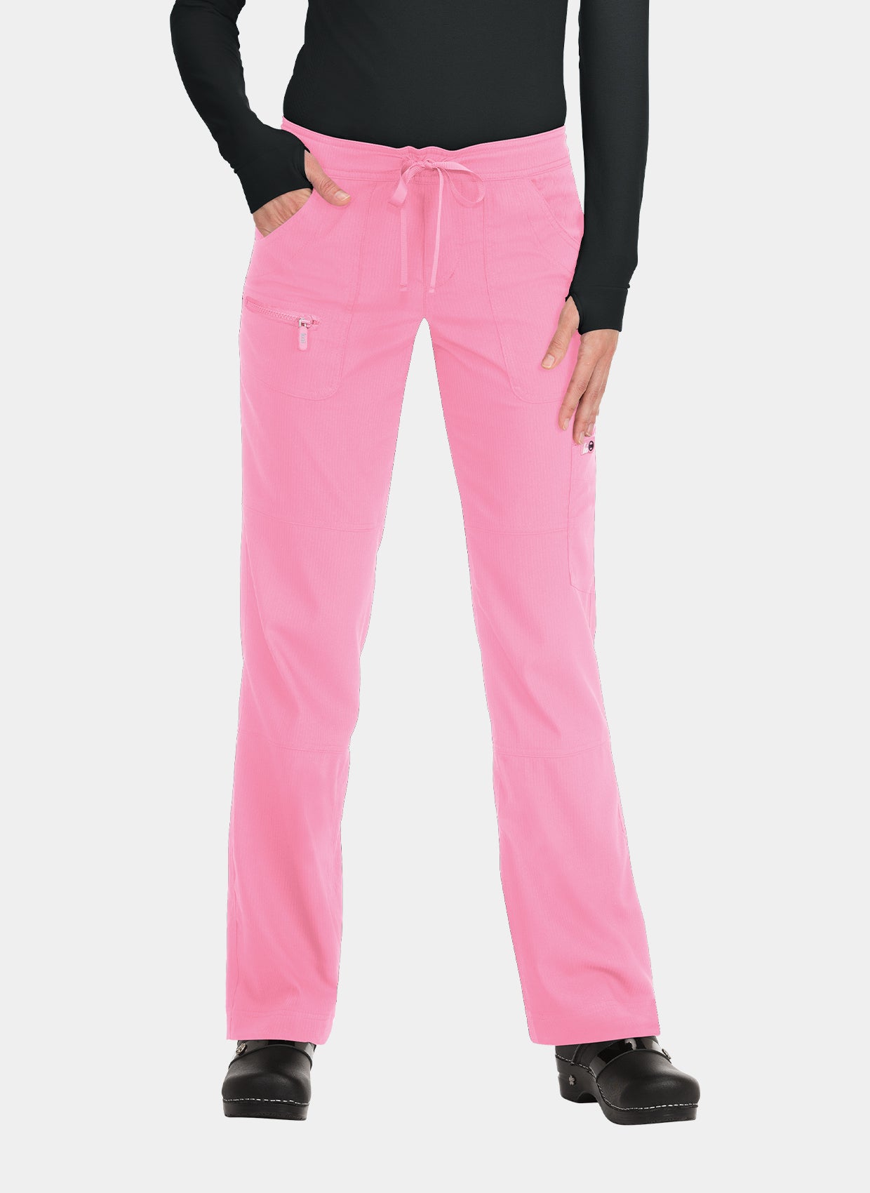 Women's pink straight-leg scrub trousers with drawstring waist, multiple pockets, and zip pocket, worn by a model.
