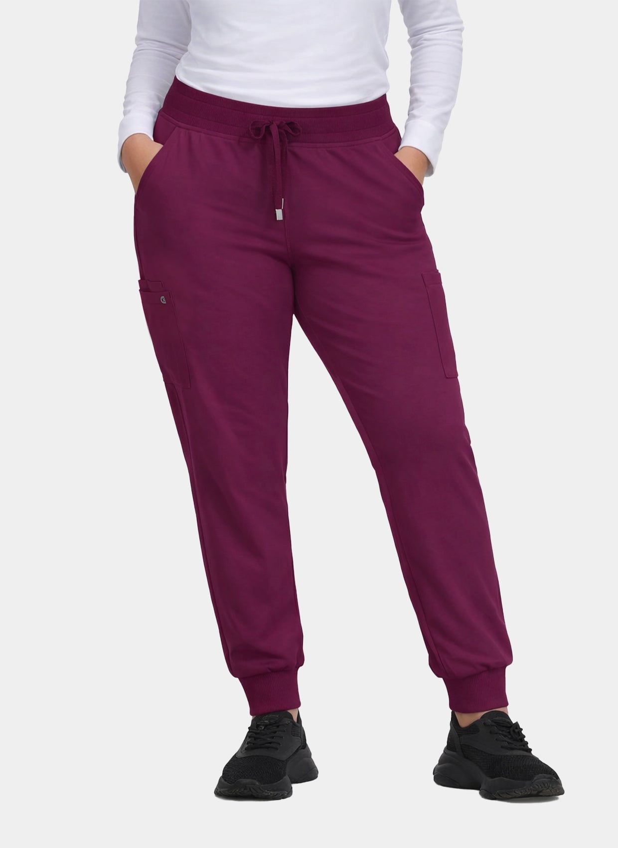 Women's wine jogger scrub trousers with cargo pockets, drawstring waist and ribbed ankle cuffs.
