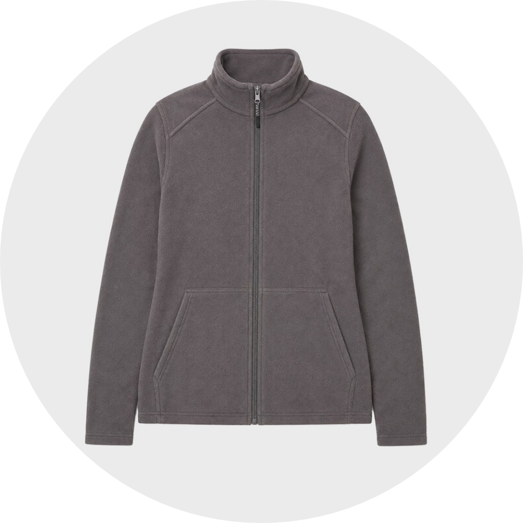 Charcoal gray unisex fleece jacket with zip front, stand collar, and angled front pockets, laid flat against a gray circular background.