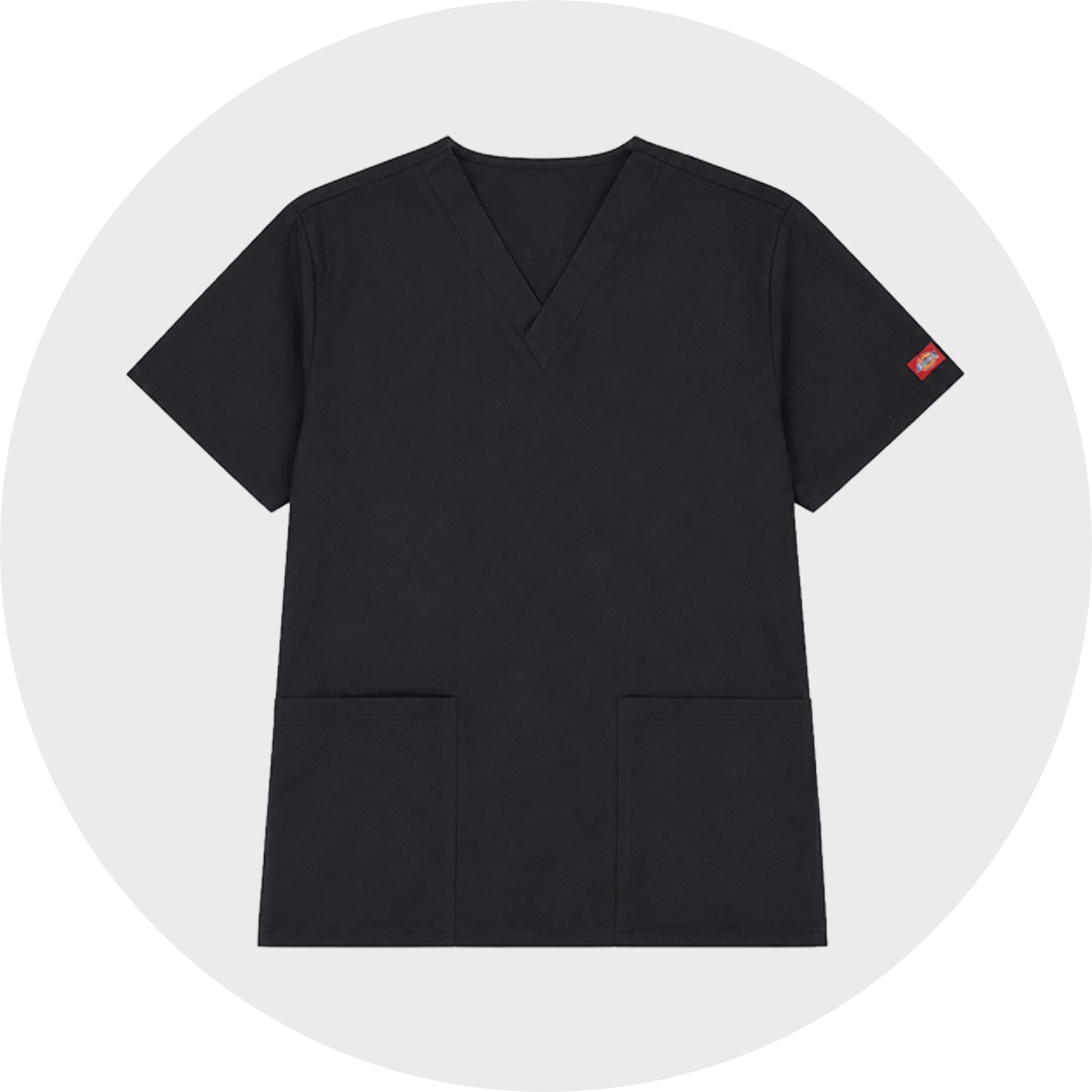 Black unisex scrub top with V-neck, short sleeves, two front patch pockets, and Dickies brand label on sleeve, laid flat against a gray circular background.