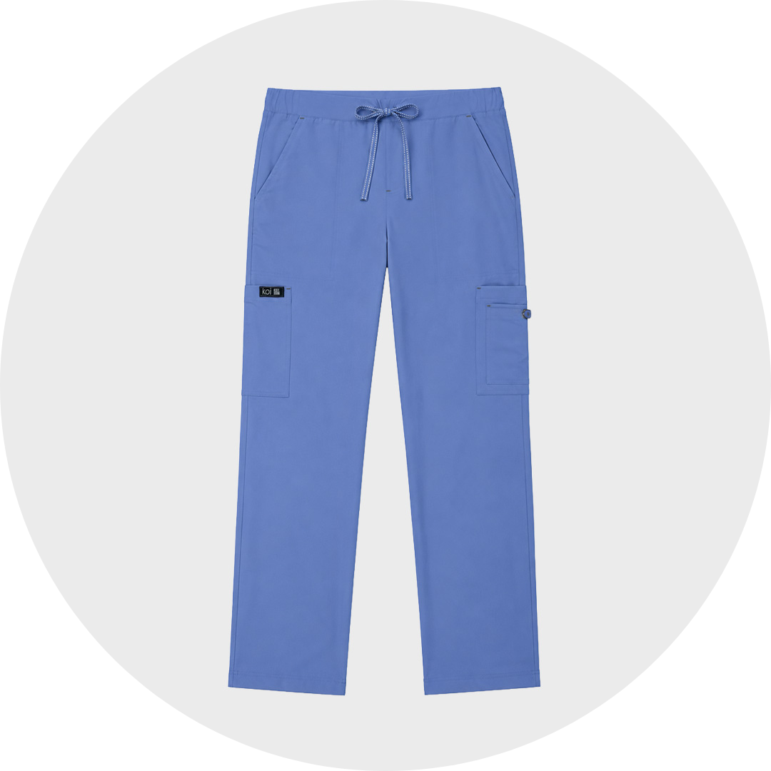Blue straight-leg women's scrub cargo trousers with an elastic drawstring waistband, slanted front pockets, and large side cargo pockets, displayed against a light gray circular background.